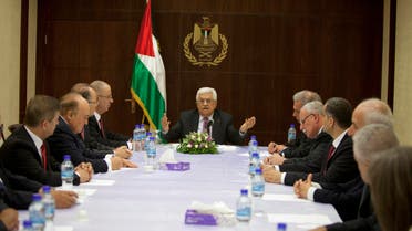 Palestinian President Mahmoud Abbas (C) meets with ministers of the unity government, in the West Bank city of Ramallah June 2, 2014. (Reuters)