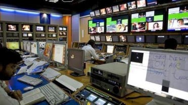 TV producers work at a control room of Geo News, a Dubai-based Pakistani television network, in Dubai November 18, 2007. 