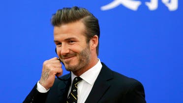 Former captain of England soccer team David Beckham attends a ceremony at the Great Hall of the People in Beijing April 21, 2014. (Reuters)