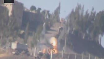Video: Syrian rebels fire rocket at regime vehicle