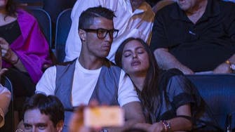 Ronaldo’s girlfriend struggles to keep awake at boxing match