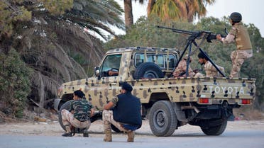 rregular forces loyal to former army general Khalifa Haftar stand by an armed vehicle during clashes with Islamist militants in the eastern city of Benghazi June 2, 2014