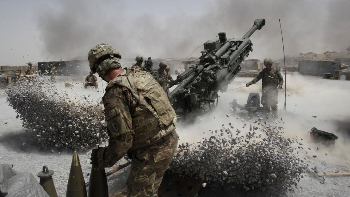 U.S. Army soldiers from the 2nd Platoon, B battery 2-8 field artillery, fire a howitzer artillery piece at Seprwan Ghar forward fire base in Panjwai district, Kandahar province southern Afghanistan, June 12, 2011. Reuters