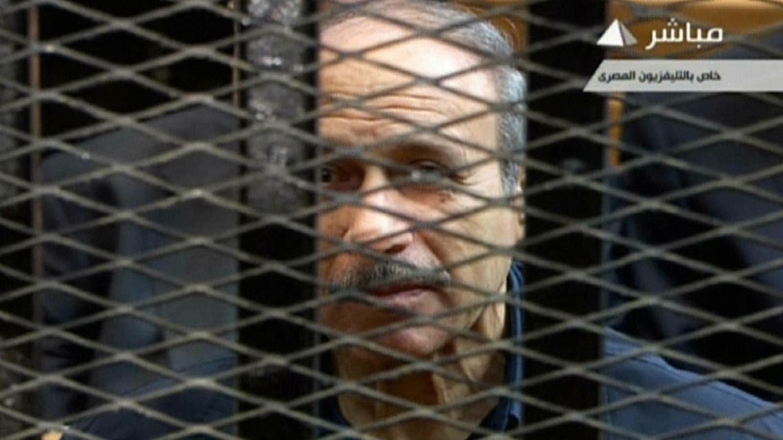 An image grab taken from Egyptian state TV shows former Egyptian interior minister Habib al-Adly behind bars during a retrial at the Police Academy in Cairo on April 13, 2013. AFP
