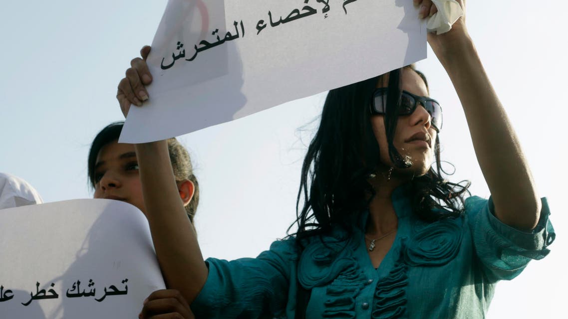 A female protester holds a sign reading "Yes to castrating the sexual harasser" as she joins others protesting against sexual harassment in Tahrir Square in Cairo June 11, 2014. (Reuters)