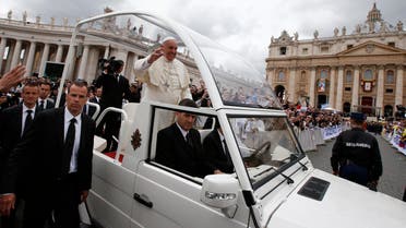 Pope Francis greets the faithful as he rides in his Popemobile after the canonisation ceremony of Popes John XXIII and John Paul II in St Peter's Square at the Vatican, April 27, 2014. (Reuters)