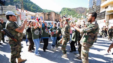 Residents and forces loyal to Syrian President Bashar al-Assad dance along a street in the Armenian Christian town of Kasab June 16, 2014. (Reuters)