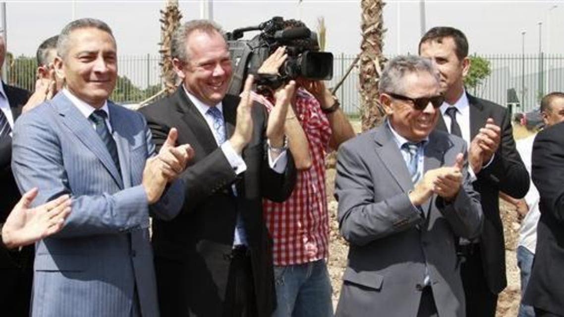 From left, Moroccan Industry Minister Hafid Alamy, Eaton President Frank Campbell and aerospace entrepreneur Hamid Benbrahim applaud Monday, June 16, 2014, as work begins on the new electronics factory near Casablanca Airport. (Photo courtesy of the Associate
