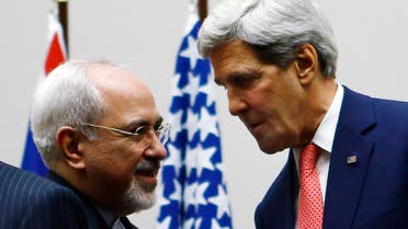 U.S. Secretary of State John Kerry (R) shakes hands with Iranian Foreign Minister Mohammad Javad Zarif after a ceremony at the United Nations in Geneva Nov. 24, 2013. (Reuters)  
