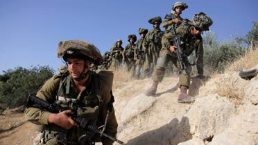 Israeli soldiers take part in an operation to locate three Israeli teens near the West Bank City of Hebron June 17, 2014. reuters