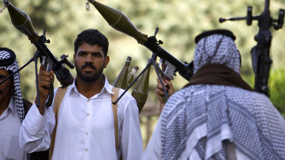 Iraqi Shiite tribesmen hold rocket propelled grenade launchers as they gather to show their readiness to join Iraqi security forces on June 16 2014. (AFP)