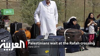 Palestinians wait at the Rafah crossing