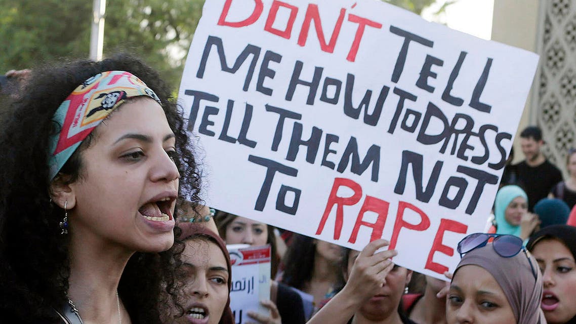 Women chant slogans as they gather to protest against sexual harassment in front of the opera house in Cairo June 14, 2014. (Reuters)