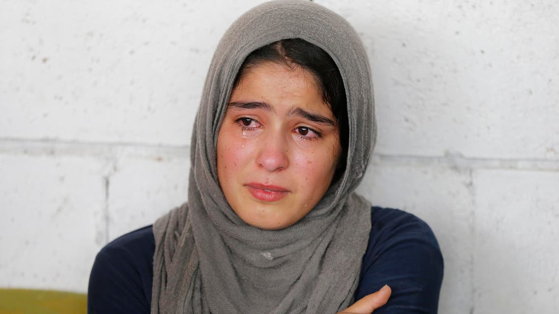 A Syrian refugee girl reacts during a visit of UN High Commissioner for Refugees (UNHCR) Antonio Guterres (not pictured) in Beirut June 19, 2014. June 20 is World Refugee Day, an occasion that draws attention to those who have been displaced around the globe. (Reuters)