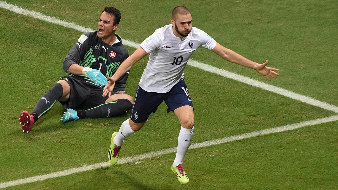 France's forward Karim Benzema celebrates after scoring during a Group E football match between Switzerland and France at the Fonte Nova Arena in Salvador during the 2014 FIFA World Cup on June 20, 2014. (AFP)