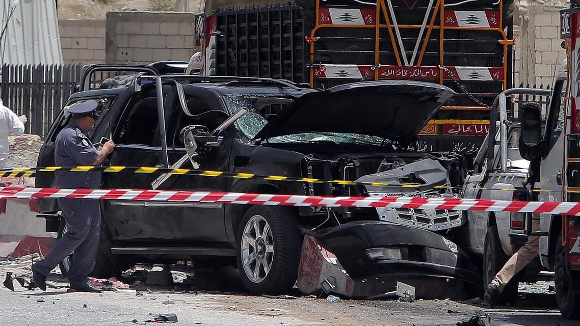 Lebanese security forces inspect the site of a suicide attack which targeted an army checkpoint on June 20, 2014. (AFP)