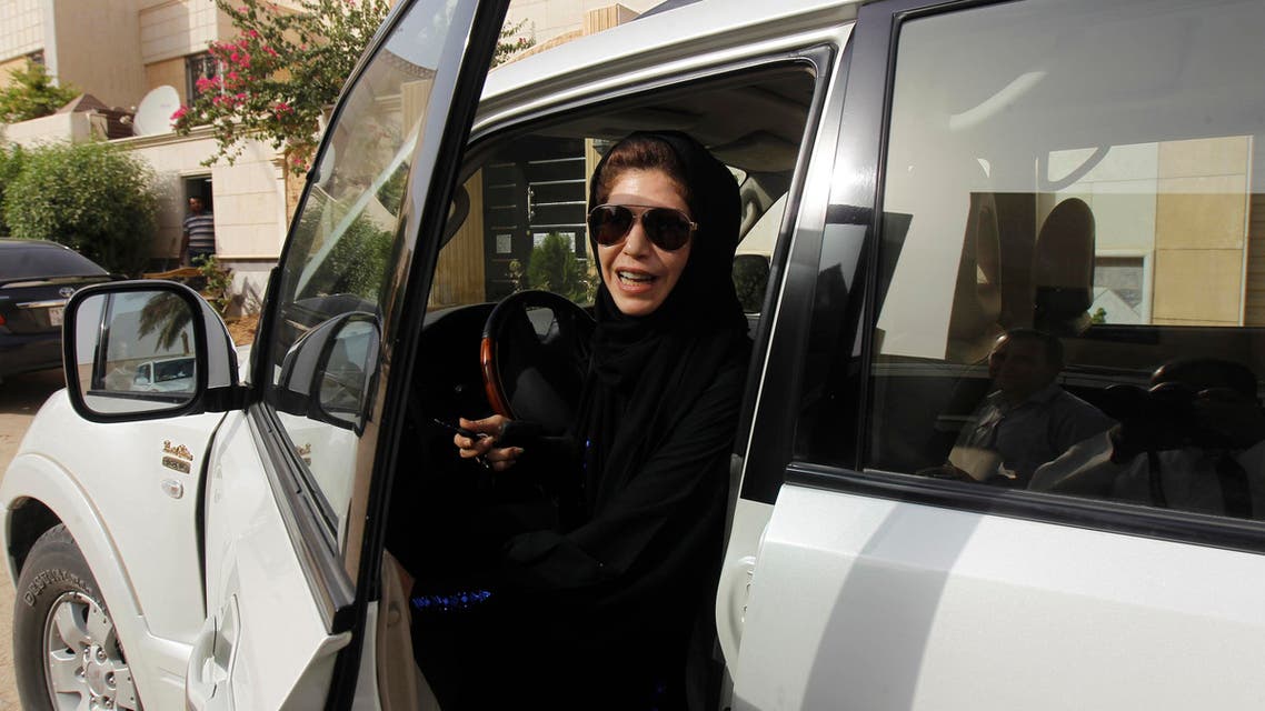 Female driver Azza al-Shmasani alights from her car after driving in defiance of the ban in Riyadh June 22, 2011. Saudi Arabia has no formal ban on women driving. But as citizens must use only Saudi-issued licenses in the country, and as these are issued only to men, women drivers are anathema. (Reuters)