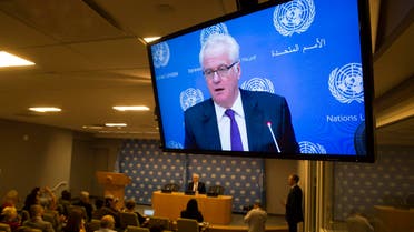 Russia's United Nations Ambassador Vitaly Churkin is shown on a television as he speaks during a news conference in New York June 3, 2014. (AFP)