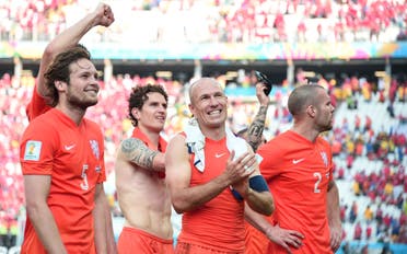 Netherlands' players celebrate after the Group B football match between Netherlands and Chile at the Corinthians Arena in Sao Paulo during the 2014 FIFA World Cup on June 23, 2014. (AFP)