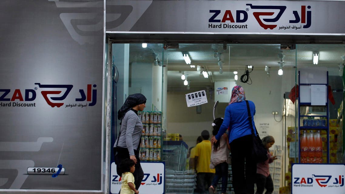 People are seen entering Zad store, established by Khairat al-Shater, a Muslim Brotherhood tycoon and financial strategist, in Cairo October 16, 2012. reuters