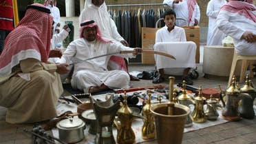 A vendor holds a sword at al-Zall souk in downtown Riyadh reuters
