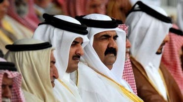 Emir of Qatar Hamad bin Khalifa Al Thani (C-R) and Crown Prince of Qatar Sheikh Tamim Bin Hamad Al Thani (C-L) 