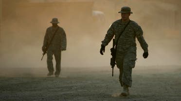 U.S. soldiers walk at the U.S. Rustamiyah camp, southeast of Baghdad September 14, 2007. (Reuters)
