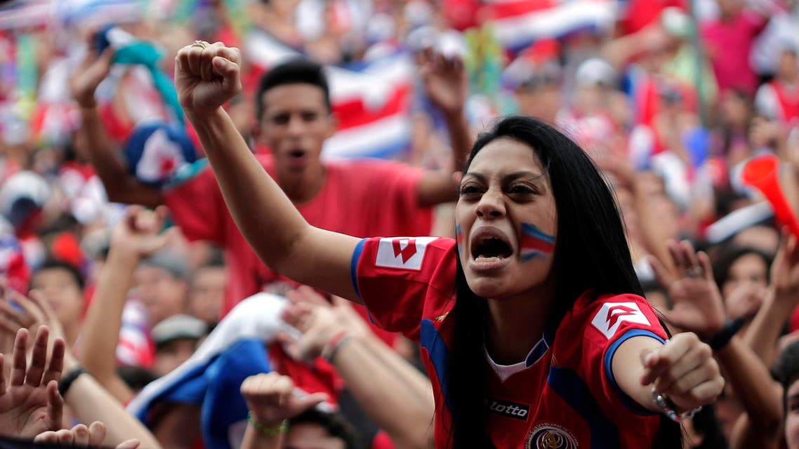 Costa Rican soccer fans celebrate while watching a large screen broadcast of the 2014 World Cup Group D soccer match between Costa Rica and England, in San Jose June 24, 2014. (Reuters)