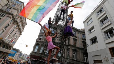 Participants hold rainbow flags during a gay pride parade in central Istanbul June 30, 2013. reuters