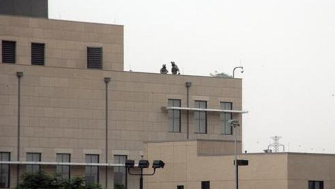 U.S. marines are seen at the top of the U.S. embassy in Khartoum September 14, 2012. (Reuters)