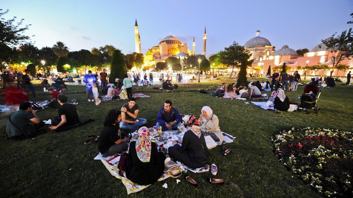 urkish people break their fasting on June 28, 2014 at the Blue Mosque square during the first day of the holy month of Ramadan in Istanbul.