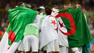 Algeria's players celebrate at the end of their 2014 World Cup Group H soccer match against Russia at the Baixada arena in Curitiba June 26, 2014. (Reuters) 