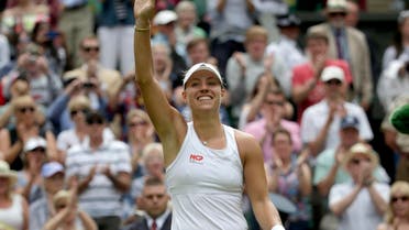 Angelique Kerber of Germany reacts after defeating Maria Sharapova of Russia in their women's singles tennis match at the Wimbledon Tennis Championships, in London July 1, 2014. 