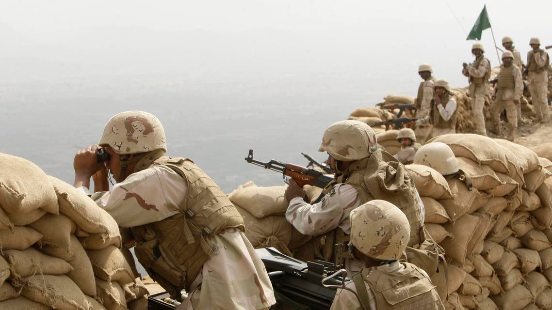 Saudi soldiers keep watch at Khoba, the frontline border with Yemen, January 27, 2010.