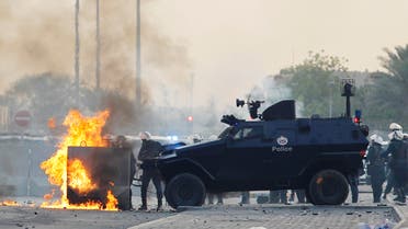 A molotov cocktail thrown by anti-government protesters explodes at a police check point as they clash during a funeral procession for their fellow protester Sayed Mohsen in the village of Sitra south of Manama, May 27, 2014. (Reuters)