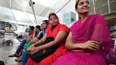 Some of the 46 Indian Nurses, held hostage by Islamic militants in Iraq, wait at the airport before flying home, on July 4, 2014, in the city of Arbil in the autonomous Kurdistan region of northern Iraq.  AFP 