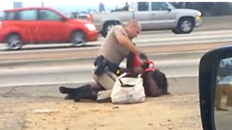 Caught on tape: U.S. officer beats woman on roadside