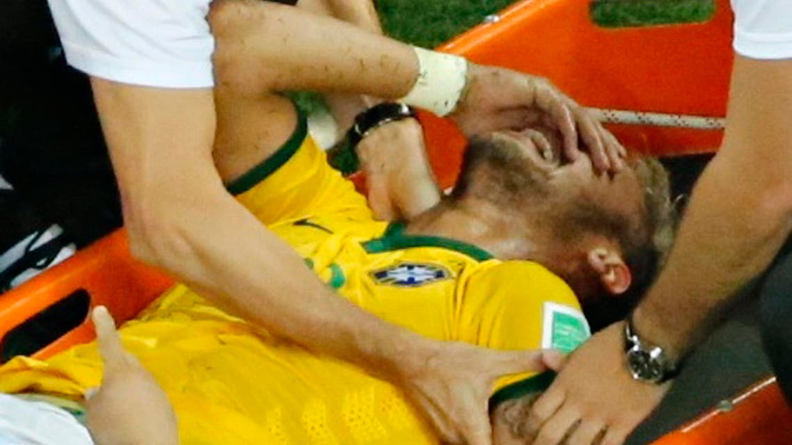 Brazil's Neymar grimaces in pain after a challenge by Colombia's Camilo Zuniga (unseen) during their 2014 World Cup quarter-finals against Colombia at the Castelao arena in Fortaleza July 4, 2014. (Reuters)