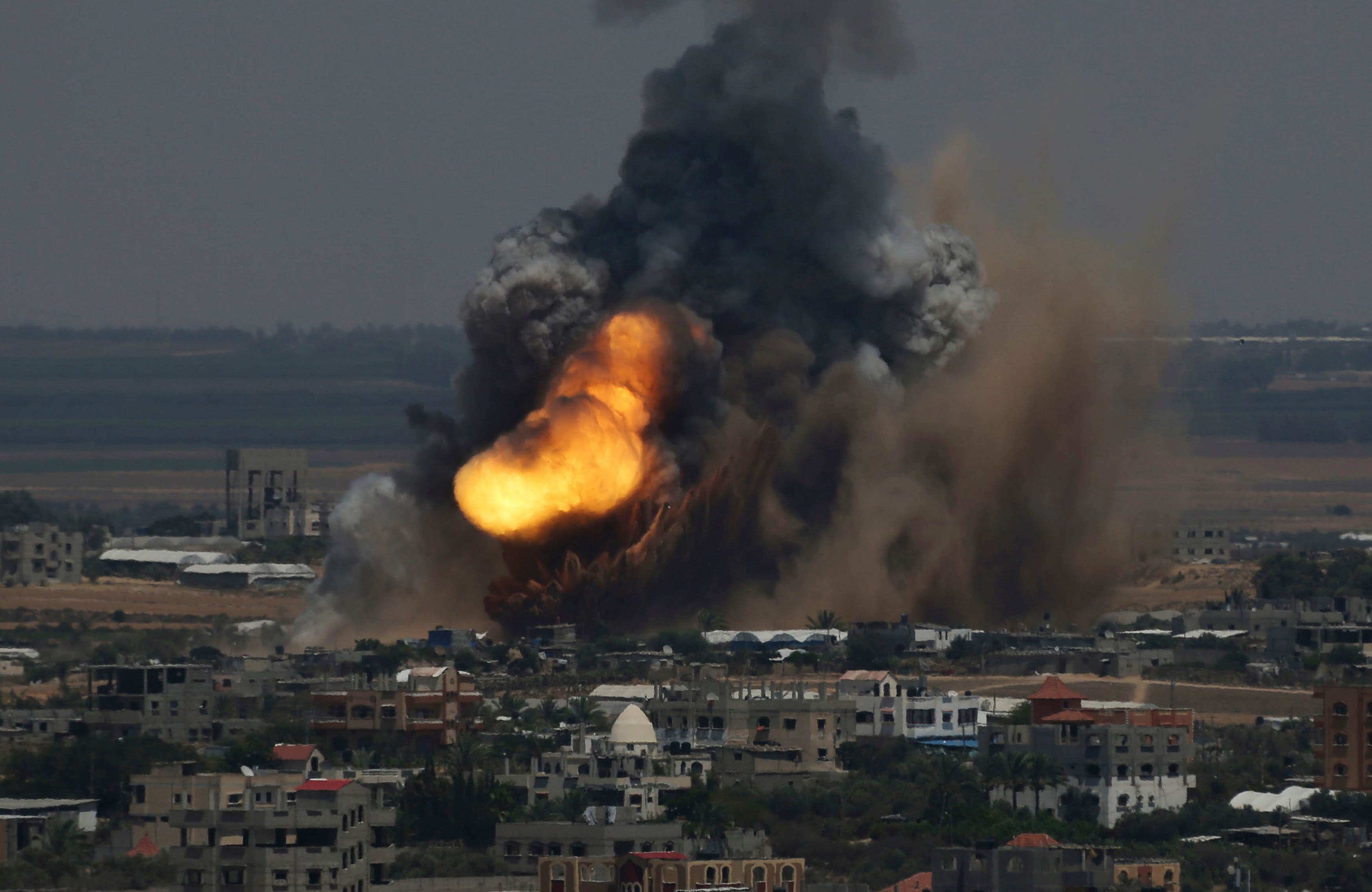 Smoke and flames are seen following what police said was an Israeli air strike in Rafah in the southern Gaza Strip July 8, 2014. (Reuters)