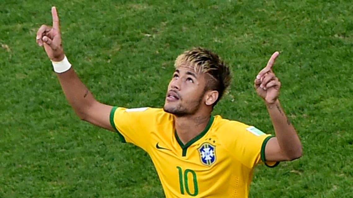Brazil's Neymar celebrates after scoring in the penalty shoot out against Chile during their 2014 World Cup round of 16 game at the Mineirao stadium in Belo Horizonte June 28, 2014. (Reuters)
