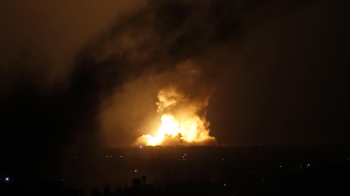 SK1314 - RAFAH, GAZA STRIP, - : A ball of fire is seen following an Israeli air strike in Rafah, in the southern Gaza Strip, on July 9, 2014. Israeli strikes on Gaza killed at least 17 people and wounded more than 100, emergency services said, as the military began an aerial campaign against militants in the Strip. AFP PHOTO / SAID KHATIB