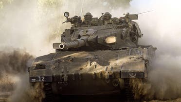 An Israeli Merkava tank rolls along the southern Israeli border with the Gaza Strip following Israeli air strikes in the Palestinian coastal enclave, on July 10, 2014. (Reuters)
