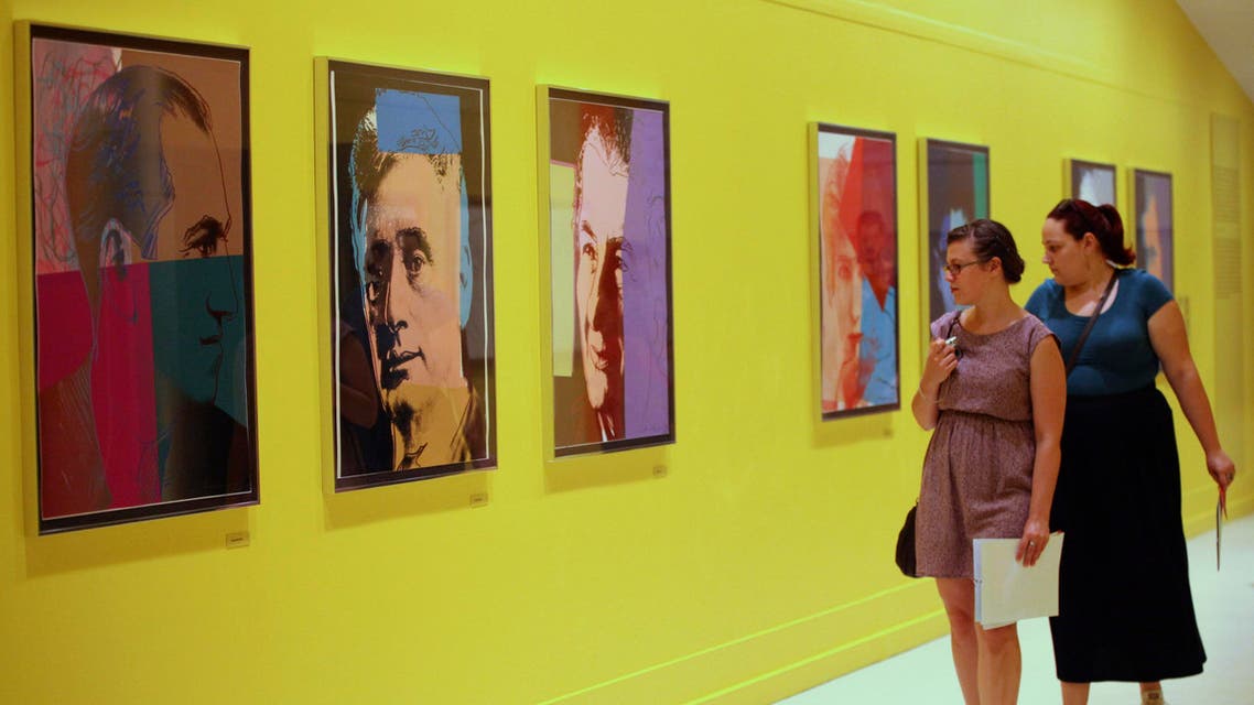 Visitors look at artworks at Pera Museum in Istanbul June 10, 2014. A show of Andy Warhol's most evocative and familiar images at Istanbul's Pera Museum portrays the pop art great in a very personal light. (Reuters)