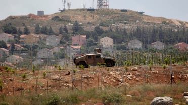 Israeli soldiers patrol near the Lebanese-Israeli border as seen from the southern Lebanese village of Mays Al-Jabal, near the border with Israel, June 7, 2014. Reuters