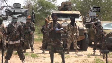 leader of the Nigerian Islamist extremist group Boko Haram, Abubakar Shekau (C). (AFP)