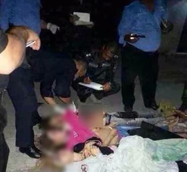  Iraqi security forces checking the bodies of alleged prostitutes after they were slaughtered by gunmen. (AFP)