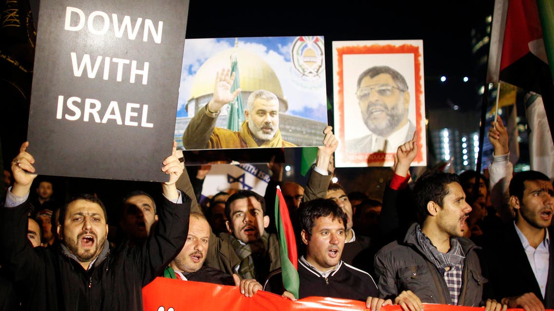 Protesters shout anti-Israel slogans during a protest against Israel's military operation in Gaza in front of the Israeli consulate in Istanbul.