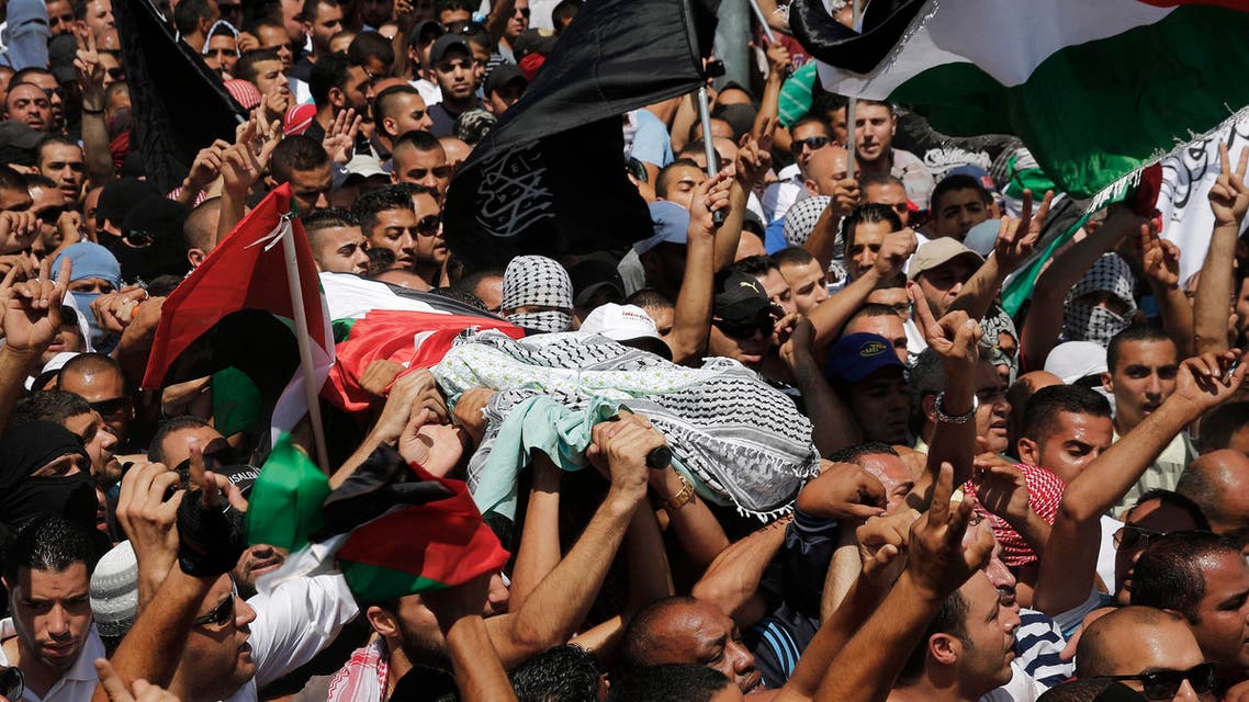 Palestinians carry the body of 16-year-old Mohammed Abu Khudair during his funeral in Shuafat, an Arab suburb of Jerusalem July 4, 2014.