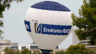 A hot air balloon bearing the logo of Emirates NBD bank hovers over the Emirates Golf Course in Dubai. (Reuters)
