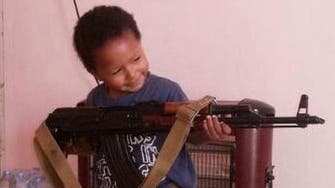 Chilling photo shows child of ISIS fighter holding AK-47